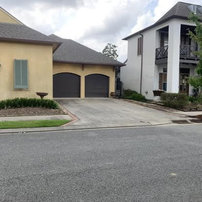 Louisiana home exterior with dirty siding, stained trim and grimy walkways before pressure washing service. Louisiana home exterior with dirty siding, stained trim and grimy walkways before pressure washing service.